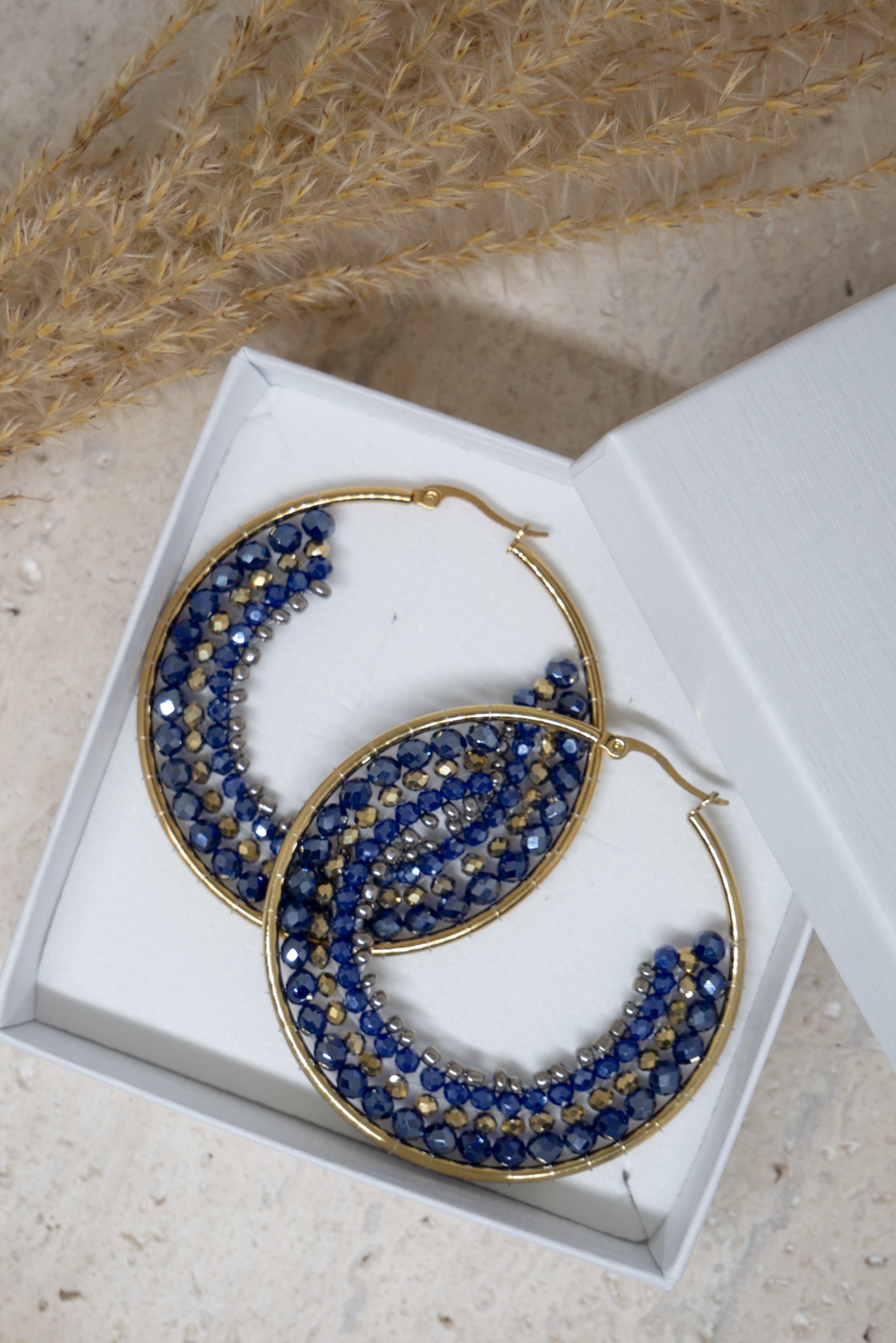 Blauwe ronde statement oorbellen