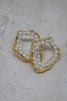Geometrische statement oorbellen met parels 