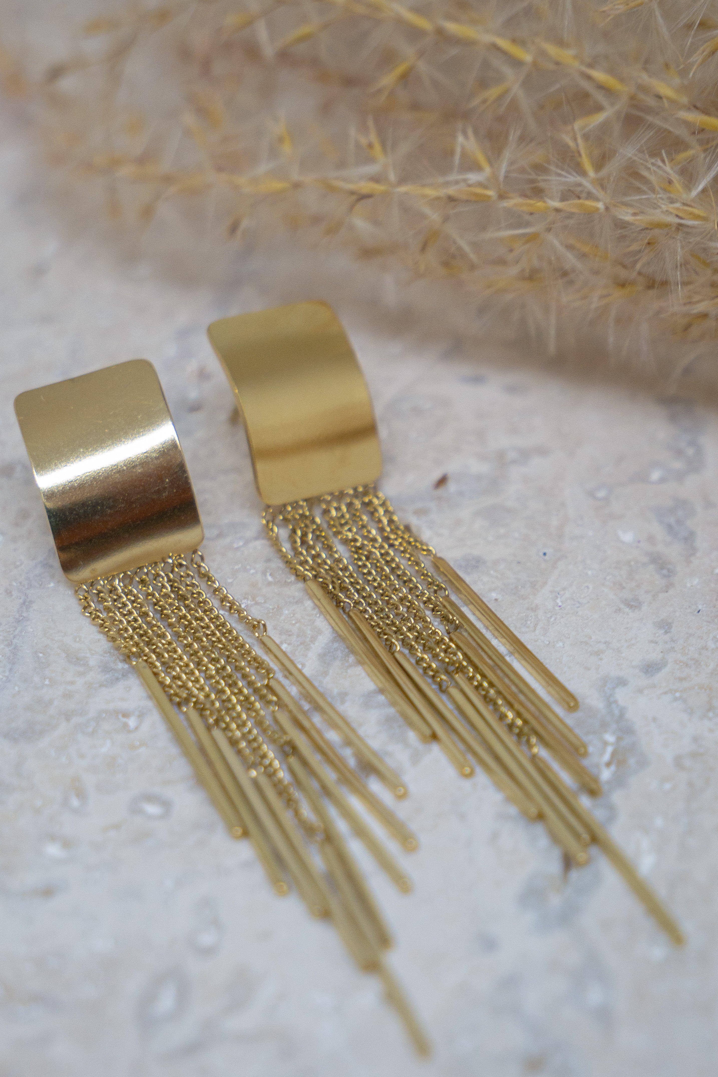 Gouden statement oorbellen met franjes